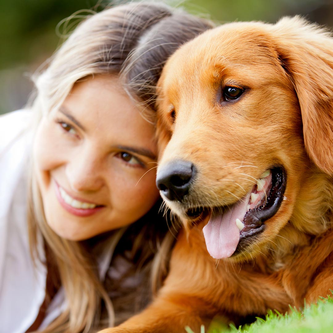 Smiling woman and her dog